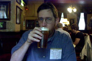 enjoying a pint at the Sherlock Holmes pub